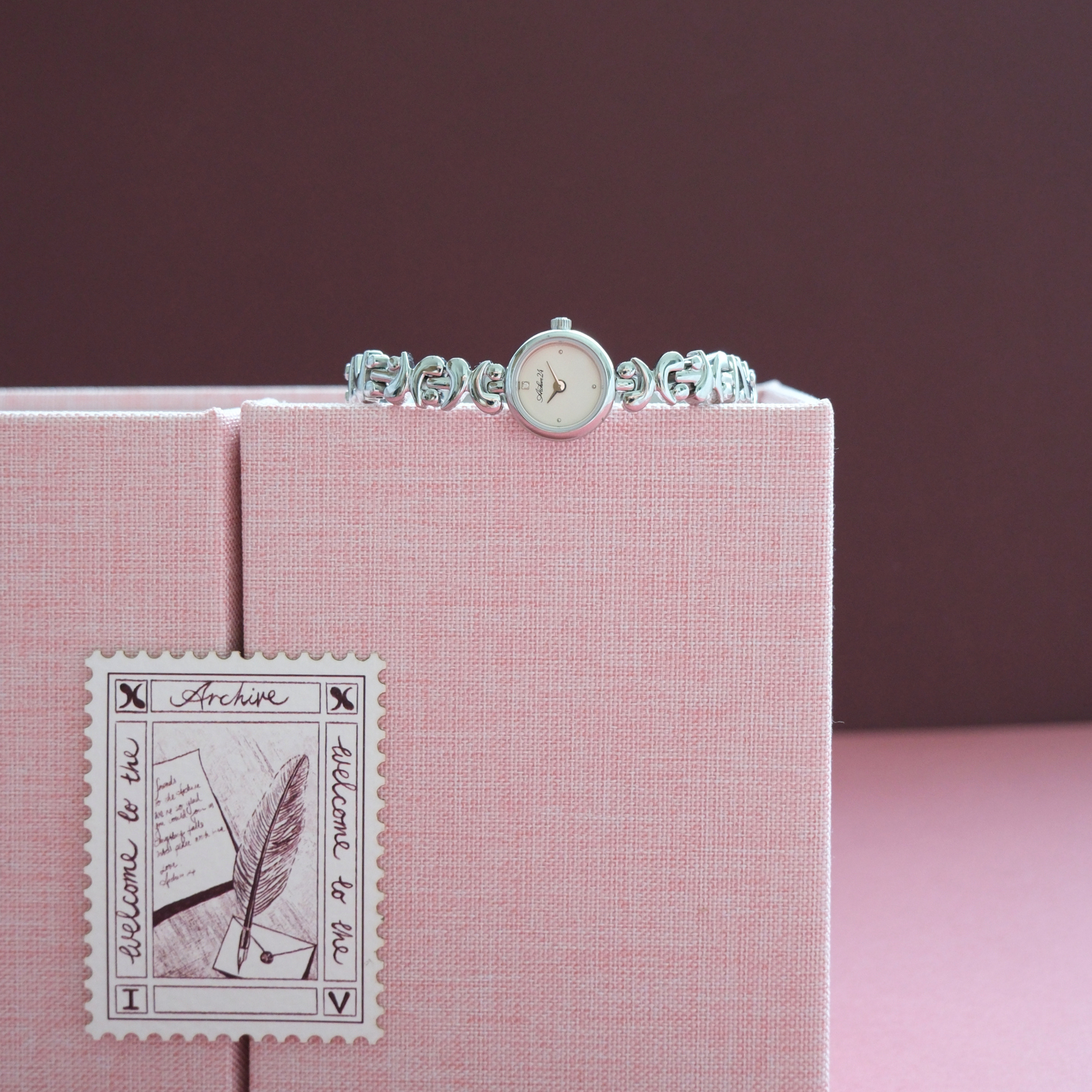 Archive24's silver XXIV jewelry watch with packaging 