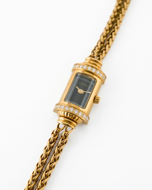 Archive24's gold jewelry watch with lab grown diamonds and chain strap on a white background
